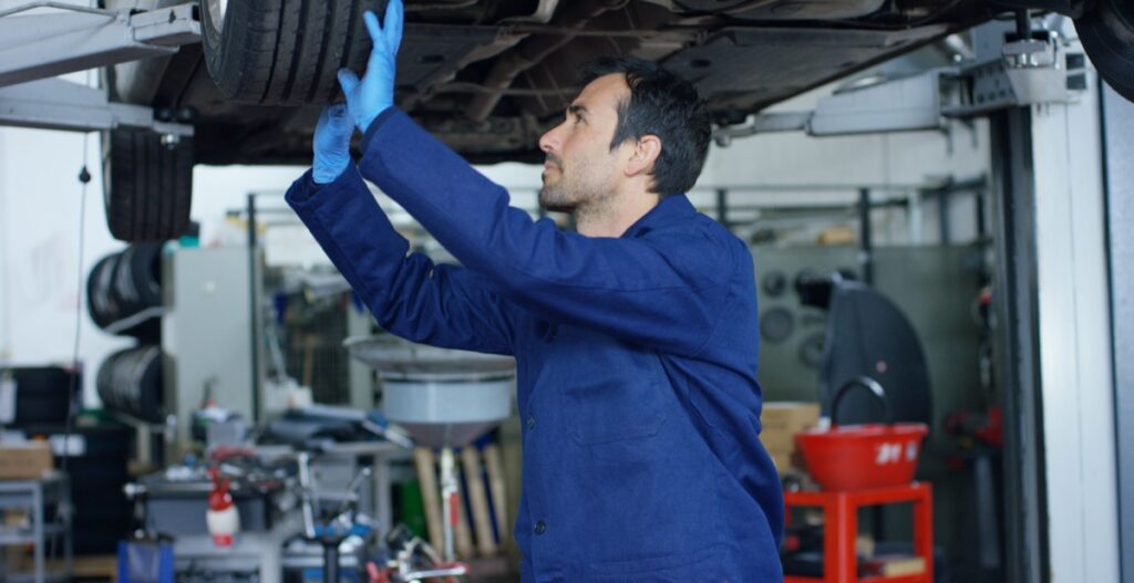 Man servicing a car